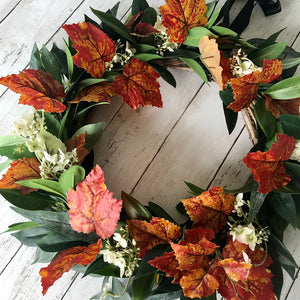 Autumn Wreath Rich russet maple leaves and lush green laurel, sprinkled with wild hydrangeas are stunning on this beautiful Autumn wreath. Looks gorgeous on both light and dark coloured doors. Bring a a touch of Autumn colour to your front door this season. This everlasting wreath can be enjoyed year after year.