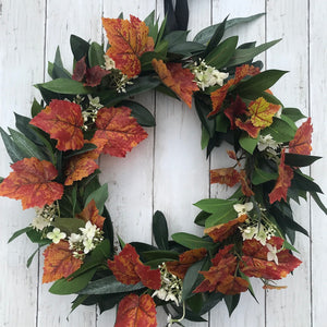 Autumn Wreath Rich russet maple leaves and lush green laurel, sprinkled with wild hydrangeas are stunning on this beautiful Autumn wreath. Looks gorgeous on both light and dark coloured doors. Bring a a touch of Autumn colour to your front door this season. This everlasting wreath can be enjoyed year after year.