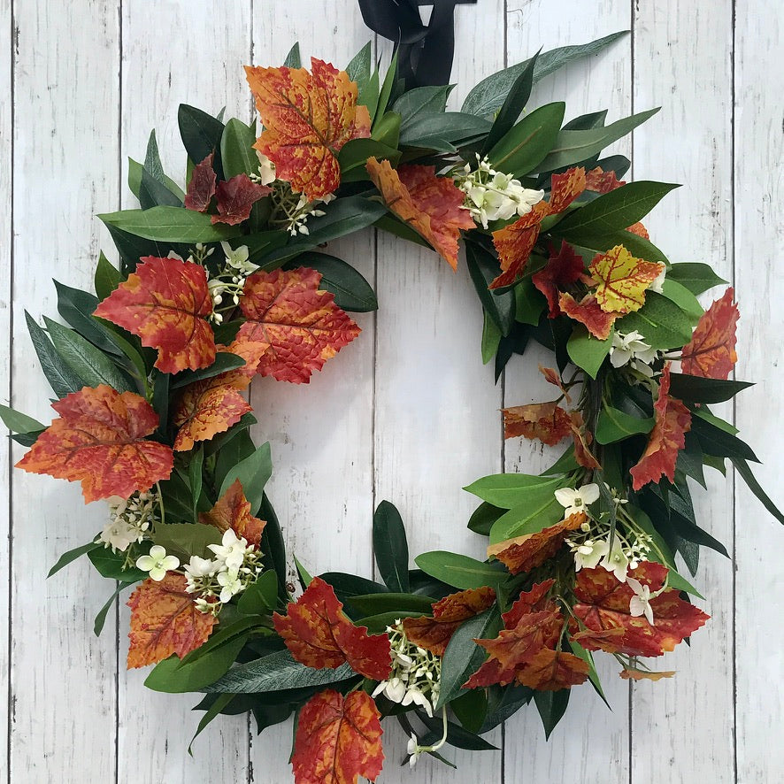 Autumn Wreath Rich russet maple leaves and lush green laurel, sprinkled with wild hydrangeas are stunning on this beautiful Autumn wreath. Looks gorgeous on both light and dark coloured doors. Bring a a touch of Autumn colour to your front door this season. This everlasting wreath can be enjoyed year after year.